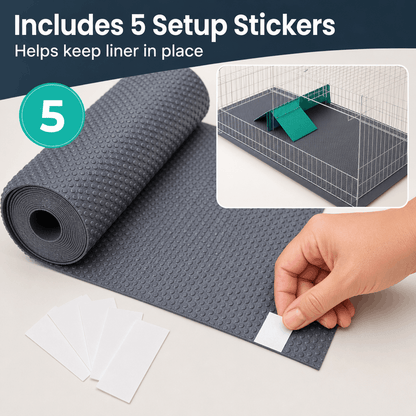Gray mat with setup stickers for keeping liner in place in a pet cage.