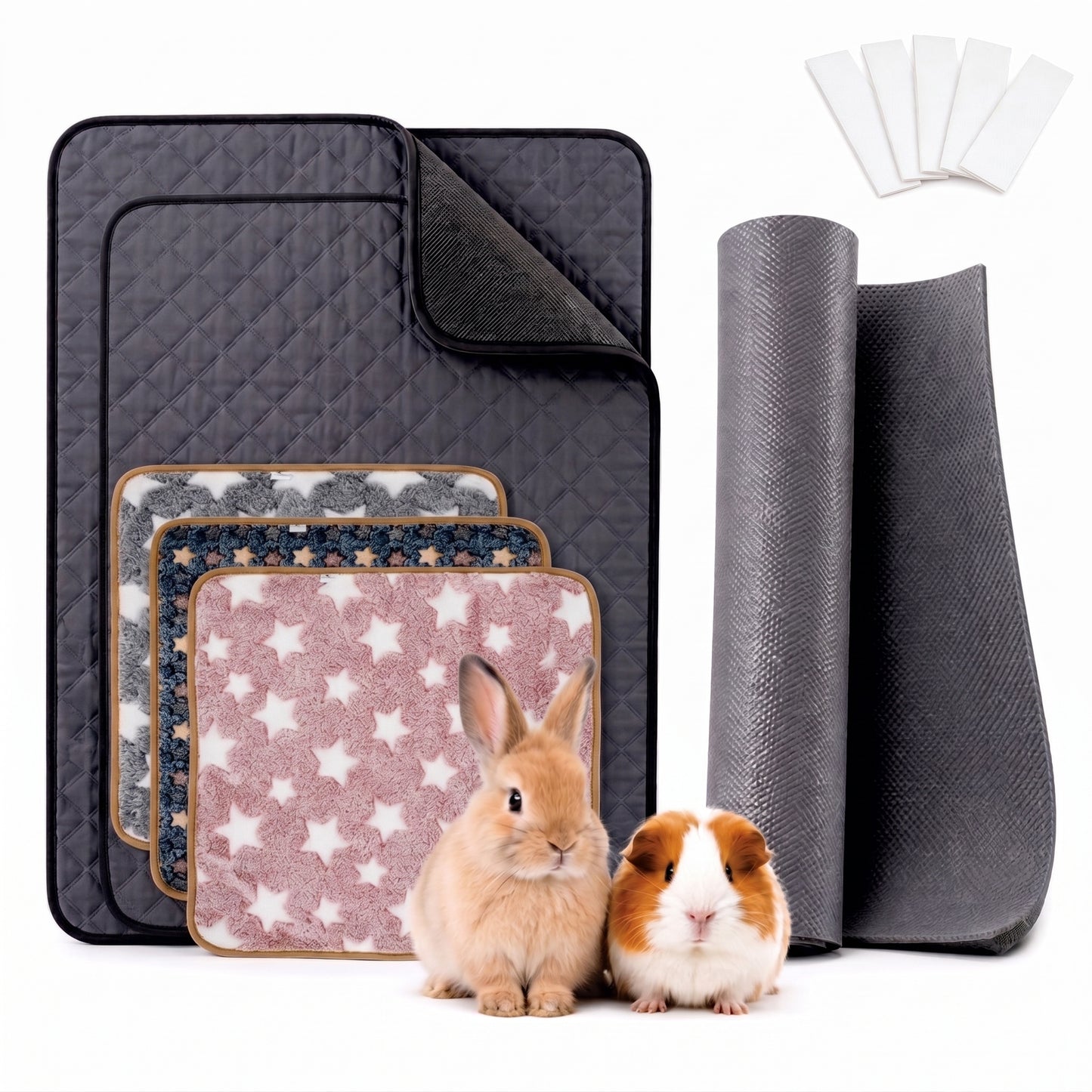 A set of pet blankets and mats shown on a white background, including a large dark gray quilted mat, smaller patterned mats, rolled dark gray mats, and a small set of white pads. A light brown rabbit and a brown-and-white guinea pig are sitting in front of the products.