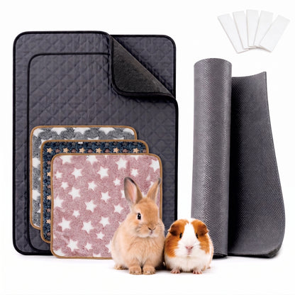 A set of pet blankets and mats shown on a white background, including a large dark gray quilted mat, smaller patterned mats, rolled dark gray mats, and a small set of white pads. A light brown rabbit and a brown-and-white guinea pig are sitting in front of the products.